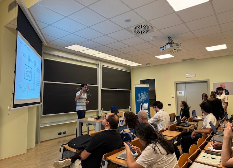 Elio giving his talk at the conference