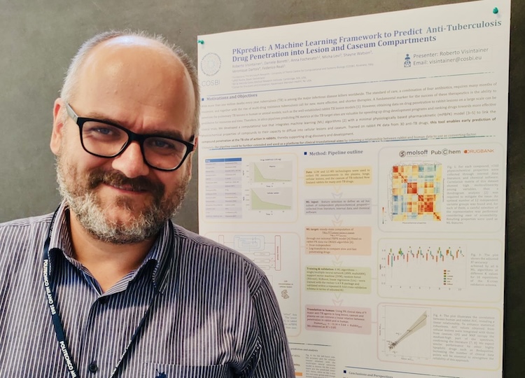 Roberto Visintainer in front of his poster at the CIBB 2025 conference