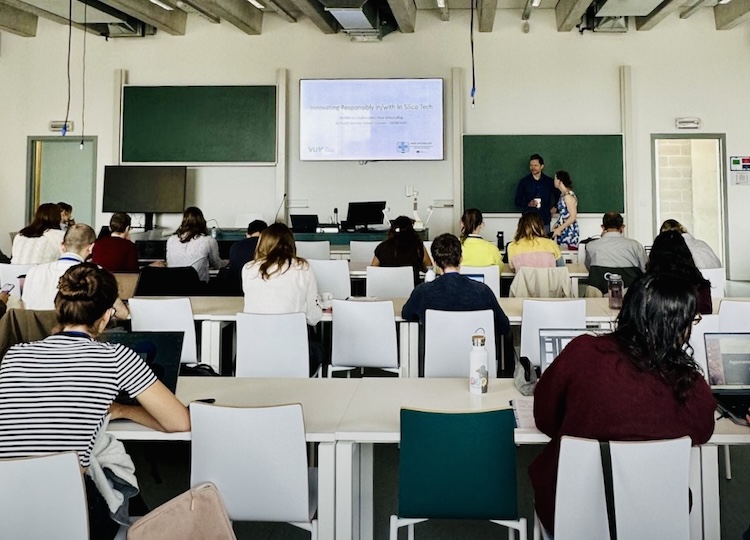 A moment in the class of the summer school with student sitting down and omeone teaching at the blackboard